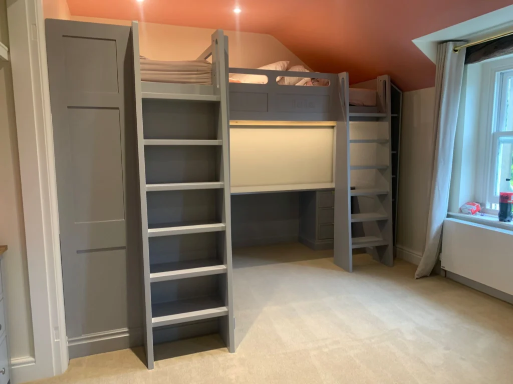 Two Childrens bunk beds with desks below with lighting